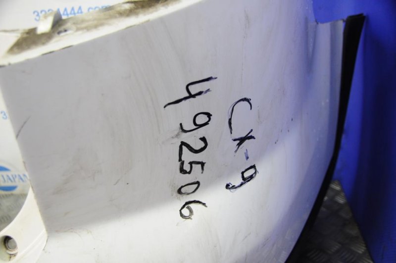 Бампер задний CX-9 06-16