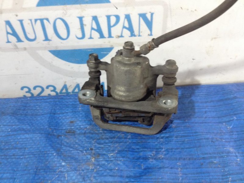 Суппорт тормозной задний левый ALTIMA L32 07-12