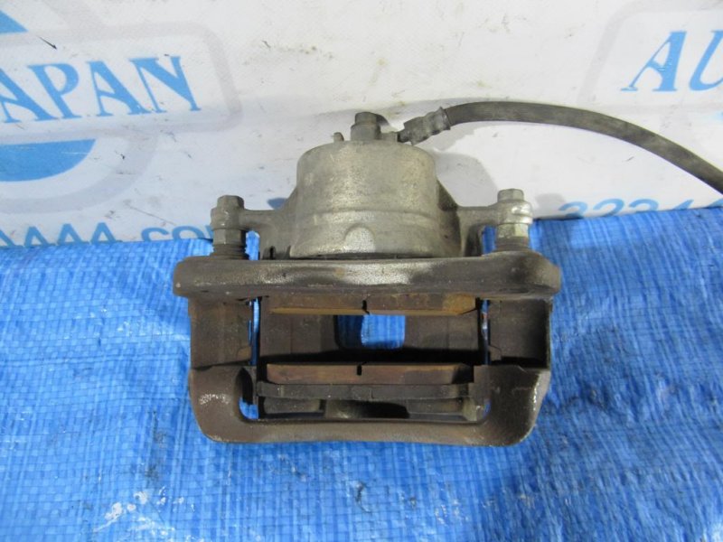 Суппорт тормозной передний левый KIA SORENTO XM 09-14 Внедорожник 2.4