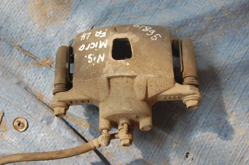 Суппорт тормозной передний левый NISSAN MICRA 03-11 41011AX000 Б/У