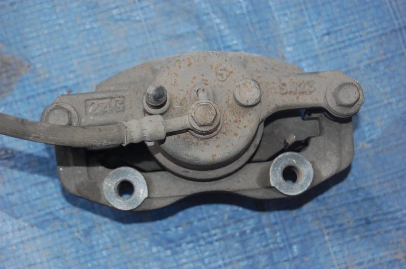 Суппорт тормозной передний левый NISSAN MICRA 03-11