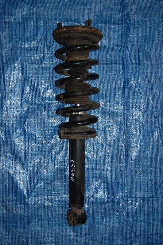 Амортизатор передний левый PAJERO 99-06