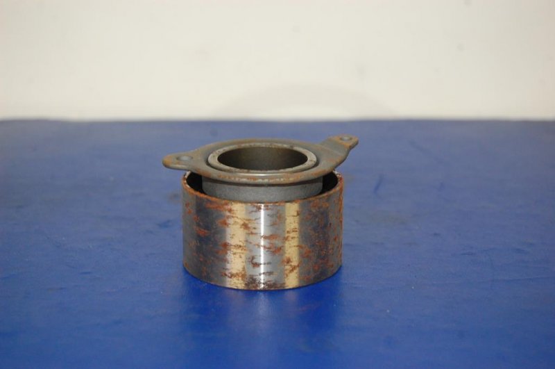 Натяжитель ремня ГРМ KIA CLARUS 96-01