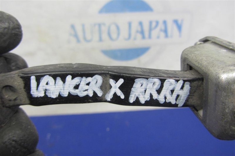 Ограничитель двери задний правый LANCER X 10 07-15