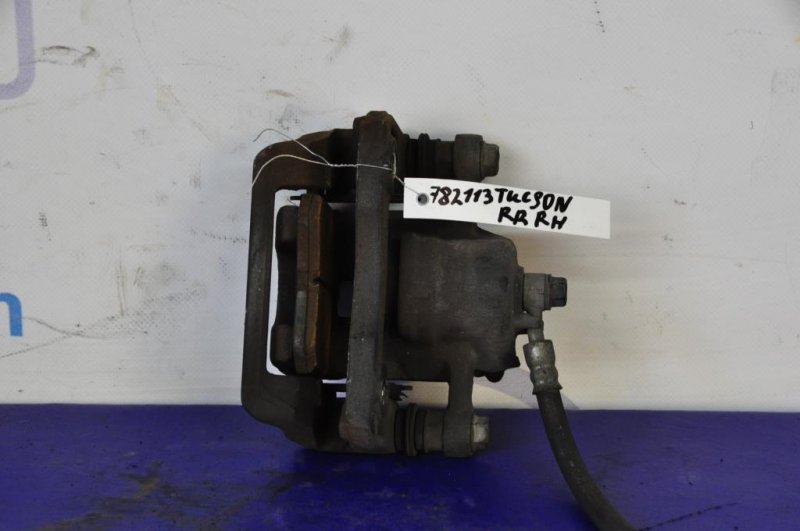 Суппорт тормозной задний правый TUCSON 04-10 Суппорт тормозной задний правый TUCSON 04-10