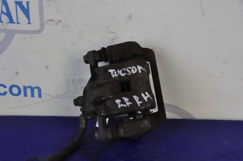 Суппорт тормозной задний правый TUCSON 04-10 Суппорт тормозной задний правый TUCSON 04-10