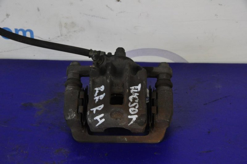 Суппорт тормозной задний правый TUCSON 04-10 Суппорт тормозной задний правый TUCSON 04-10