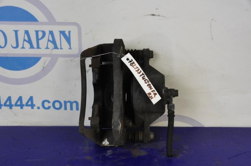 Суппорт тормозной передний правый TUCSON 04-10