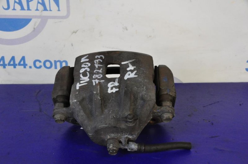 Суппорт тормозной передний правый TUCSON 04-10