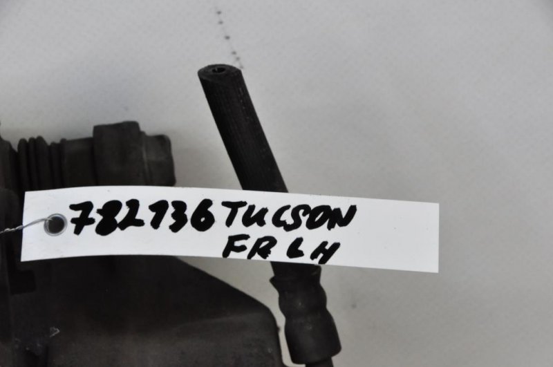 Суппорт тормозной передний левый TUCSON 04-10 Суппорт тормозной передний левый TUCSON 04-10