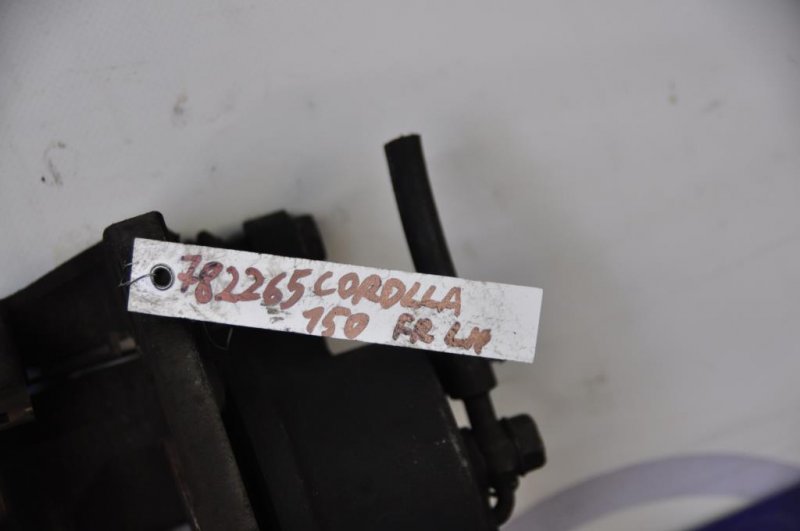 Суппорт тормозной передний левый COROLLA 150 06-13