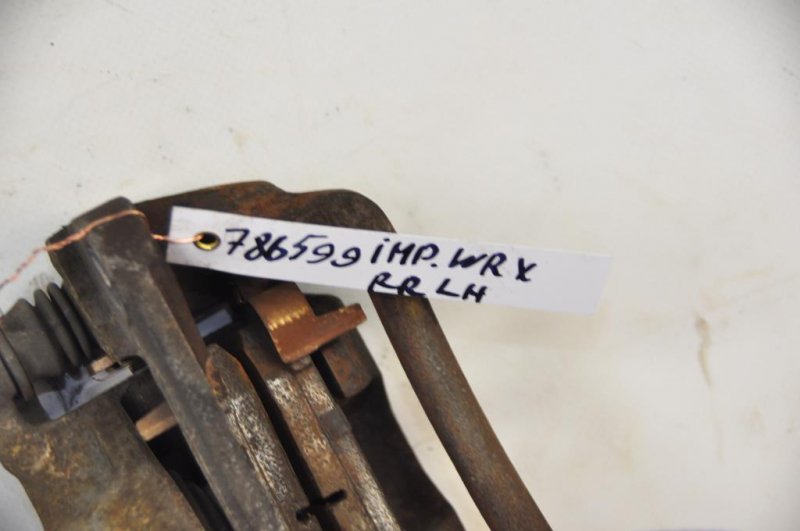 Суппорт тормозной задний левый IMPREZA 07-11 GE/GH