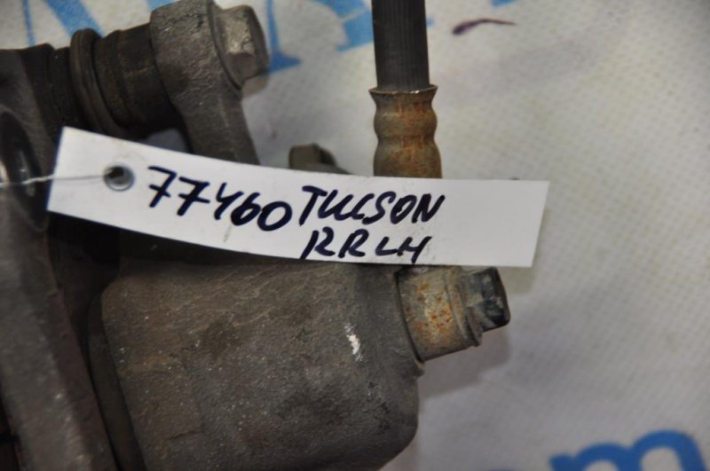 Суппорт тормозной задний левый TUCSON 04-10