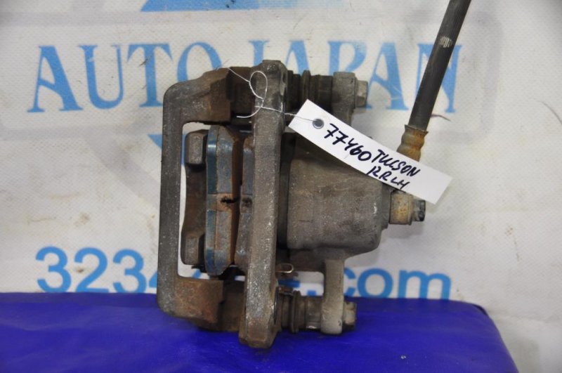 Суппорт тормозной задний левый HYUNDAI TUCSON 04-10