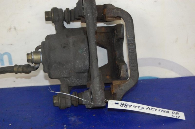 Суппорт тормозной задний левый NISSAN ALTIMA L32 07-12 VQ25DE 4Cyl Суппорт тормозной задний левый NISSAN ALTIMA L32 07-12 VQ25DE 4Cyl