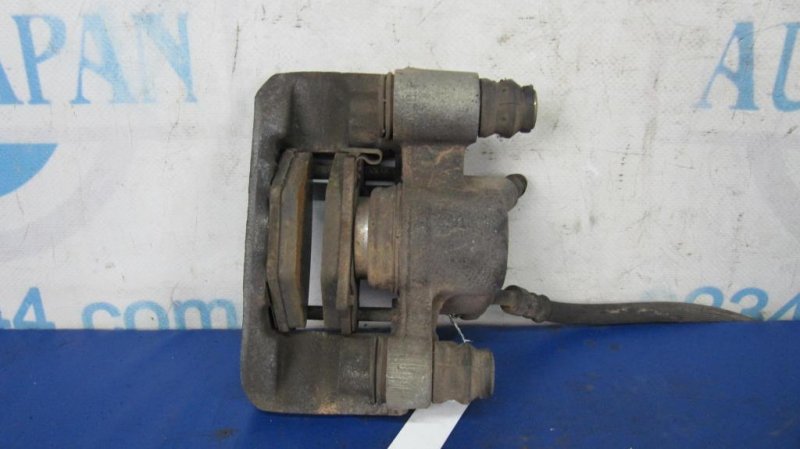 Суппорт тормозной задний левый TOYOTA COROLLA 120 00-07