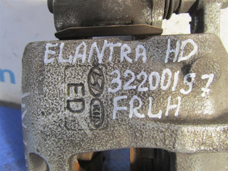 Суппорт тормозной передний левый ELANTRA HD 06-11