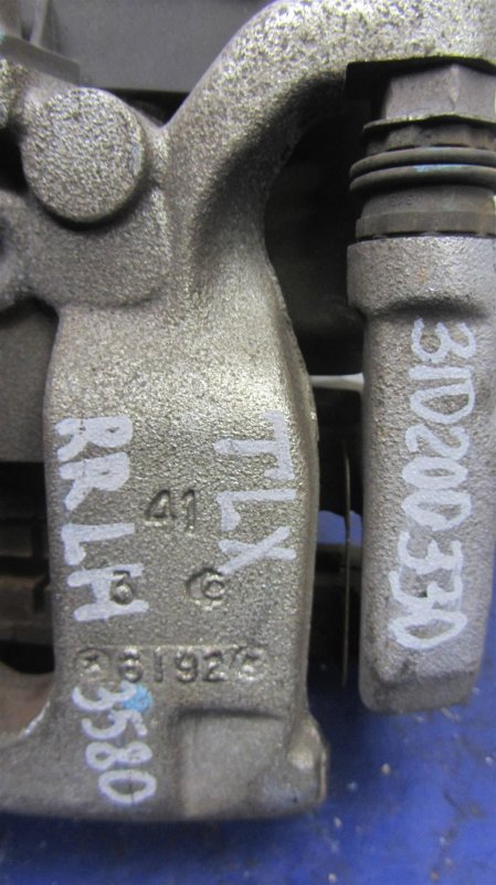 Суппорт тормозной задний левый TLX 14-17 2017 Седан 2.4