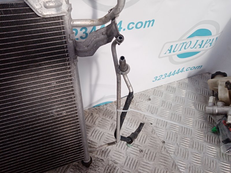 Радиатор кондиционера CX-7 06-12