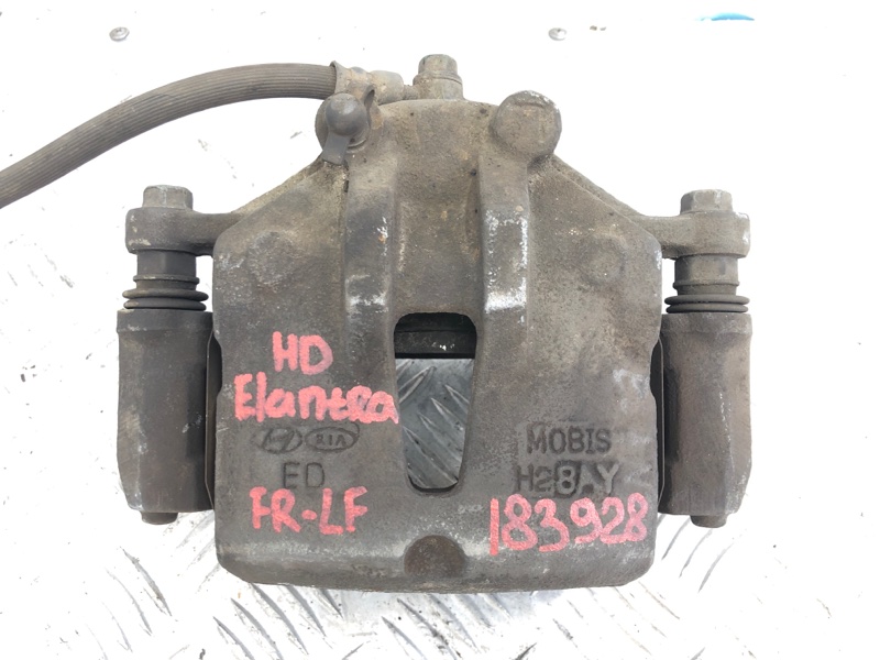 Суппорт тормозной передний левый ELANTRA HD 06-11