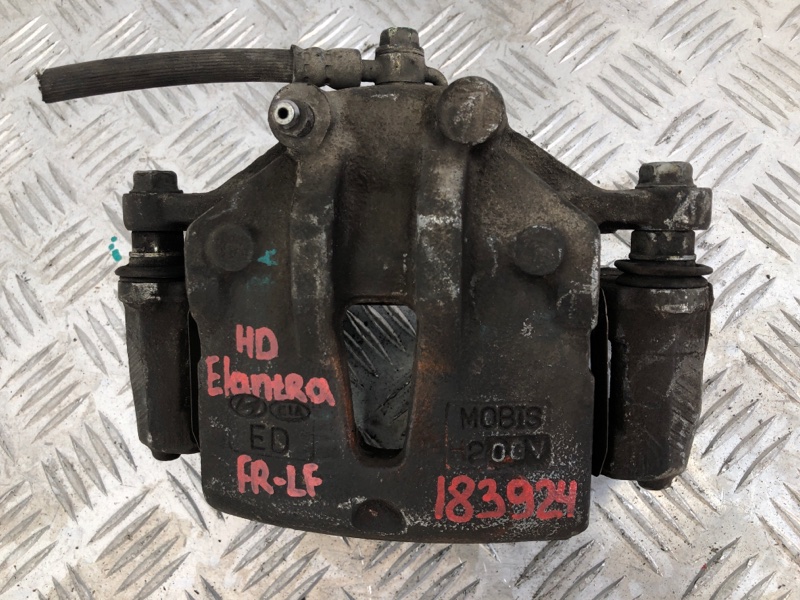 Суппорт тормозной передний левый ELANTRA HD 06-11