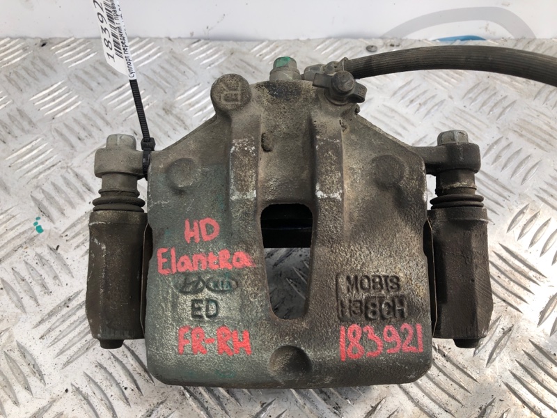 Суппорт тормозной передний правый ELANTRA HD 06-11