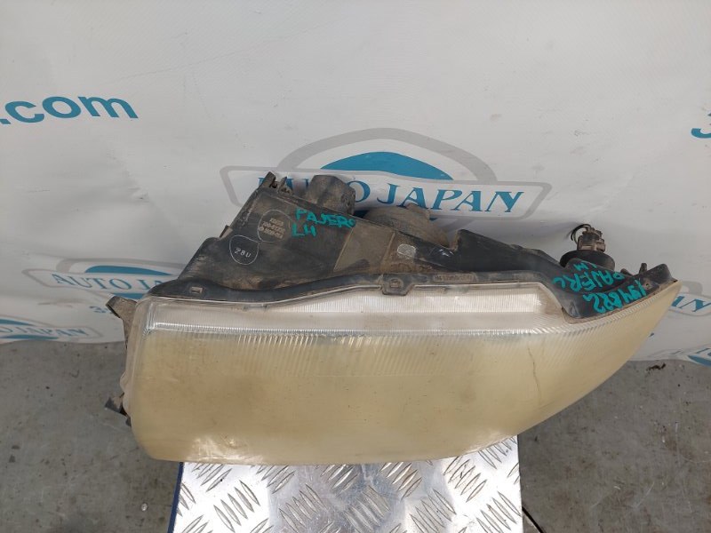 Фара передняя левая PAJERO 99-06