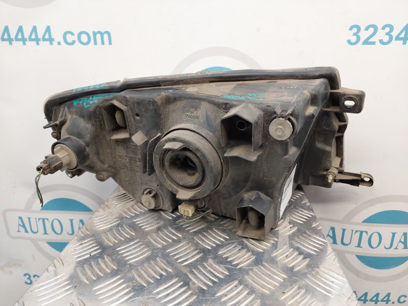 Фара передняя левая MITSUBISHI PAJERO 99-06