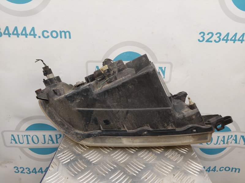 Фара передняя левая PAJERO 99-06