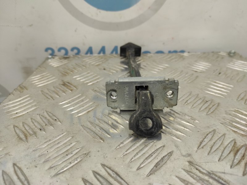 Ограничитель двери передний левый CX-7 06-12 2010 Внедорожник 2.5 Ограничитель двери передний левый CX-7 06-12 2010 Внедорожник 2.5