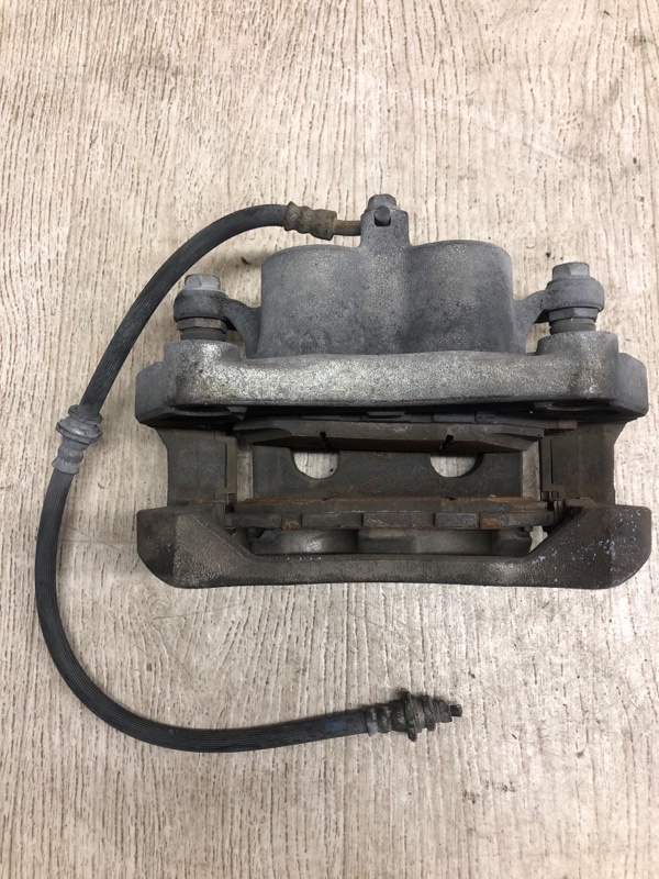 Суппорт тормозной передний левый NISSAN PATHFINDER R52 12-21 R52 3.5 VQ35DE