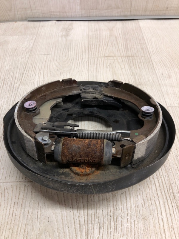 Тормозной механизм задний левый NV200 USA 13- 2020 M20XUS 2.0 MR20DE