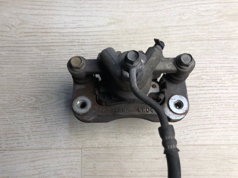 Суппорт тормозной задний левый FORTE/CERATO TD 08-13 2009 TD 2.0 G4KD