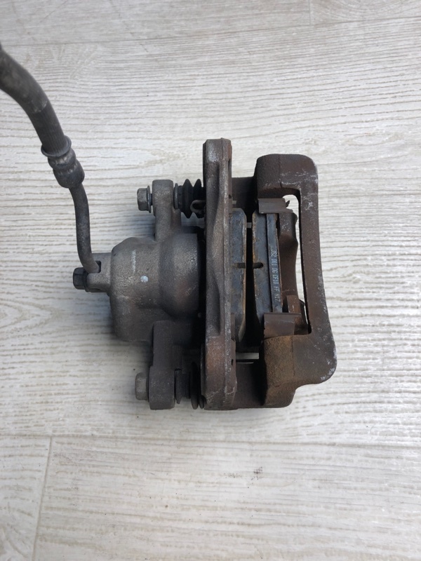 Суппорт тормозной задний левый KIA FORTE/CERATO TD 08-13 TD 2.0 G4KD