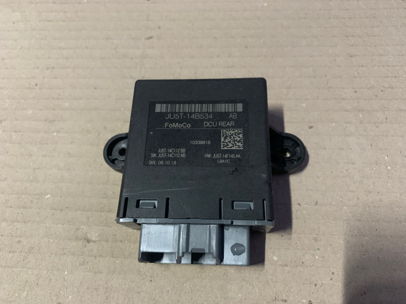 Запчасть блок управления дверей задний правый FORD FUSION 14- MK5 JU5T-14B534-AB Б/У Блок управления дверей задний правый FORD FUSION 14- MK5 JU5T-14B534-AB Б/У