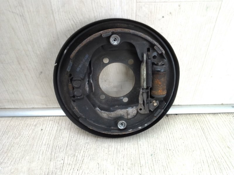 Тормозной механизм задний левый NISSAN NV200 USA 13- 2015 M20XUS 2.0 MR20DE 440103LM0A Б/У