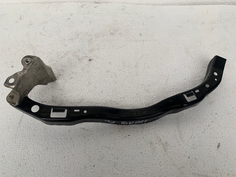 Кронштейн крепления фары левый LEGACY 03-09 BL/BP 2003-2006