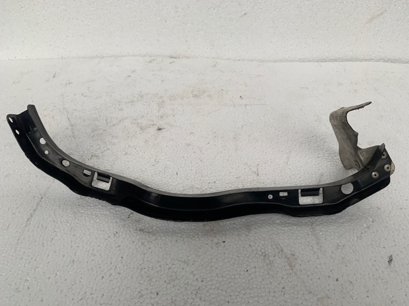 Кронштейн крепления фары левый LEGACY 03-09 BL/BP 2003-2006