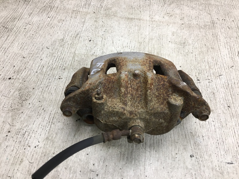 Суппорт тормозной передний левый NISSAN NV200 USA 13- M20XUS 2.0 MR20DE