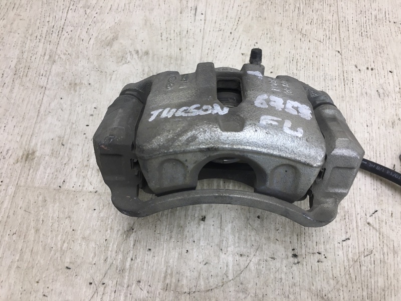 Суппорт тормозной передний левый TUCSON LM 09-15 2014 LM 2.0 G4KD Суппорт тормозной передний левый TUCSON LM 09-15 2014 LM 2.0 G4KD