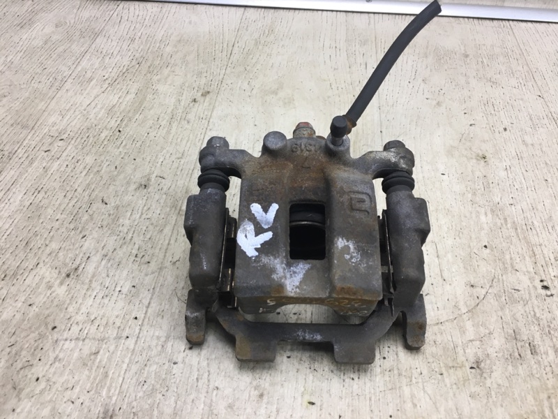 Суппорт тормозной задний левый G25/G35/G37/Q40 06-14