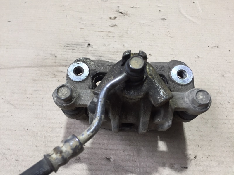 Суппорт тормозной задний левый KIA FORTE/CERATO TD 08-13 Седан G4KD 2.0L Суппорт тормозной задний левый KIA FORTE/CERATO TD 08-13 Седан G4KD 2.0L