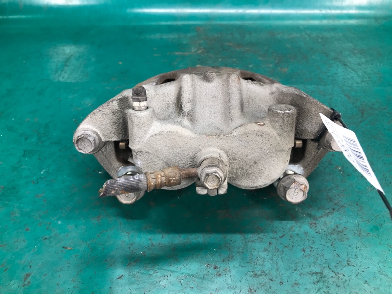 Суппорт тормозной передний левый NISSAN LEAF 10-17