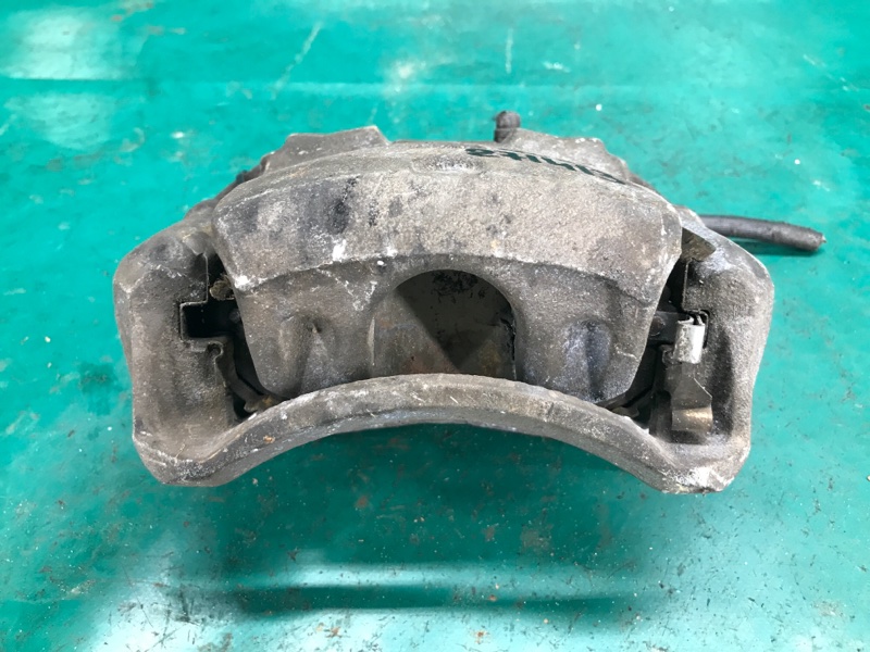 Суппорт тормозной передний левый NISSAN NV200 USA 13- Минивэн 2.0