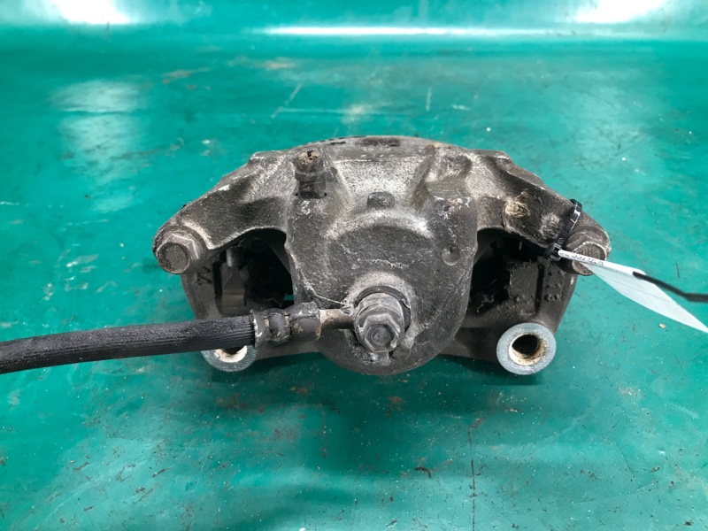 Суппорт тормозной передний левый NV200 USA 13- Минивэн 2.0