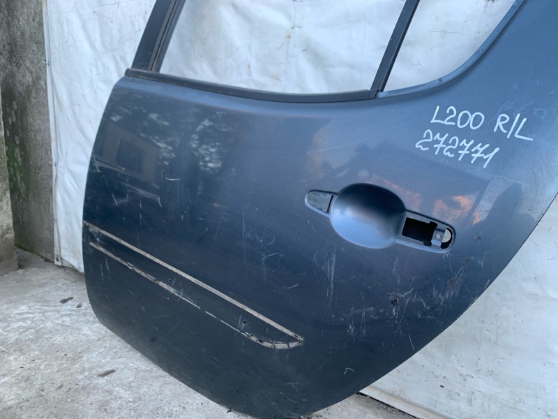 Дверь задняя левая L200 06-14