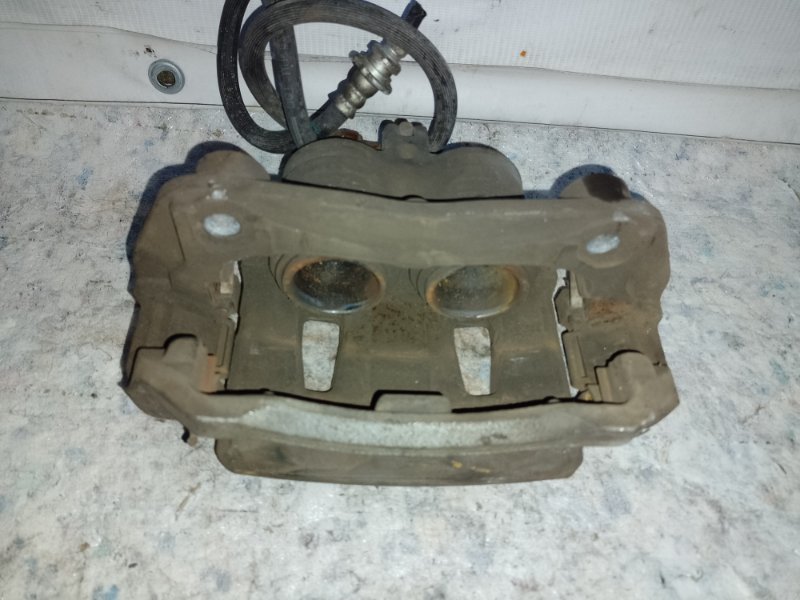 Суппорт тормозной передний левый NV200 USA 13- 2017 2.0 MR20DE