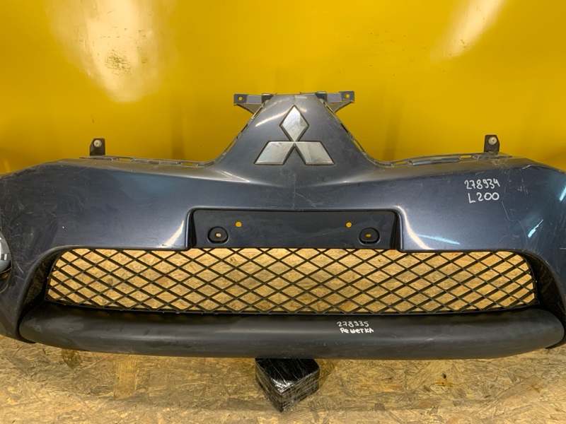Бампер передний L200 06-14