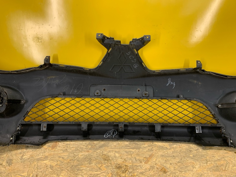 Бампер передний L200 06-14