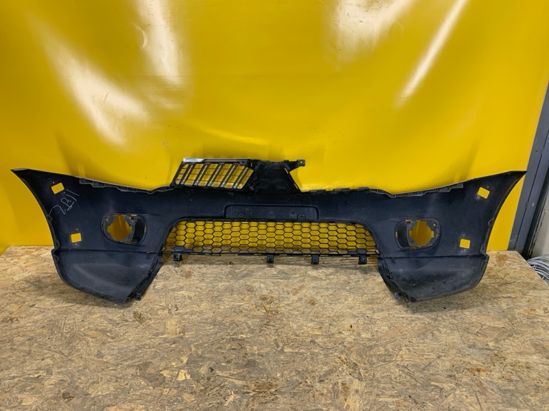 Бампер передний L200 06-14